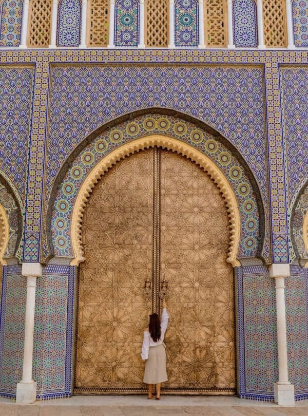 Traditional Moroccan door with zellige tilework in Fes Medina, the starting point for Morocco tours departing from Fes.